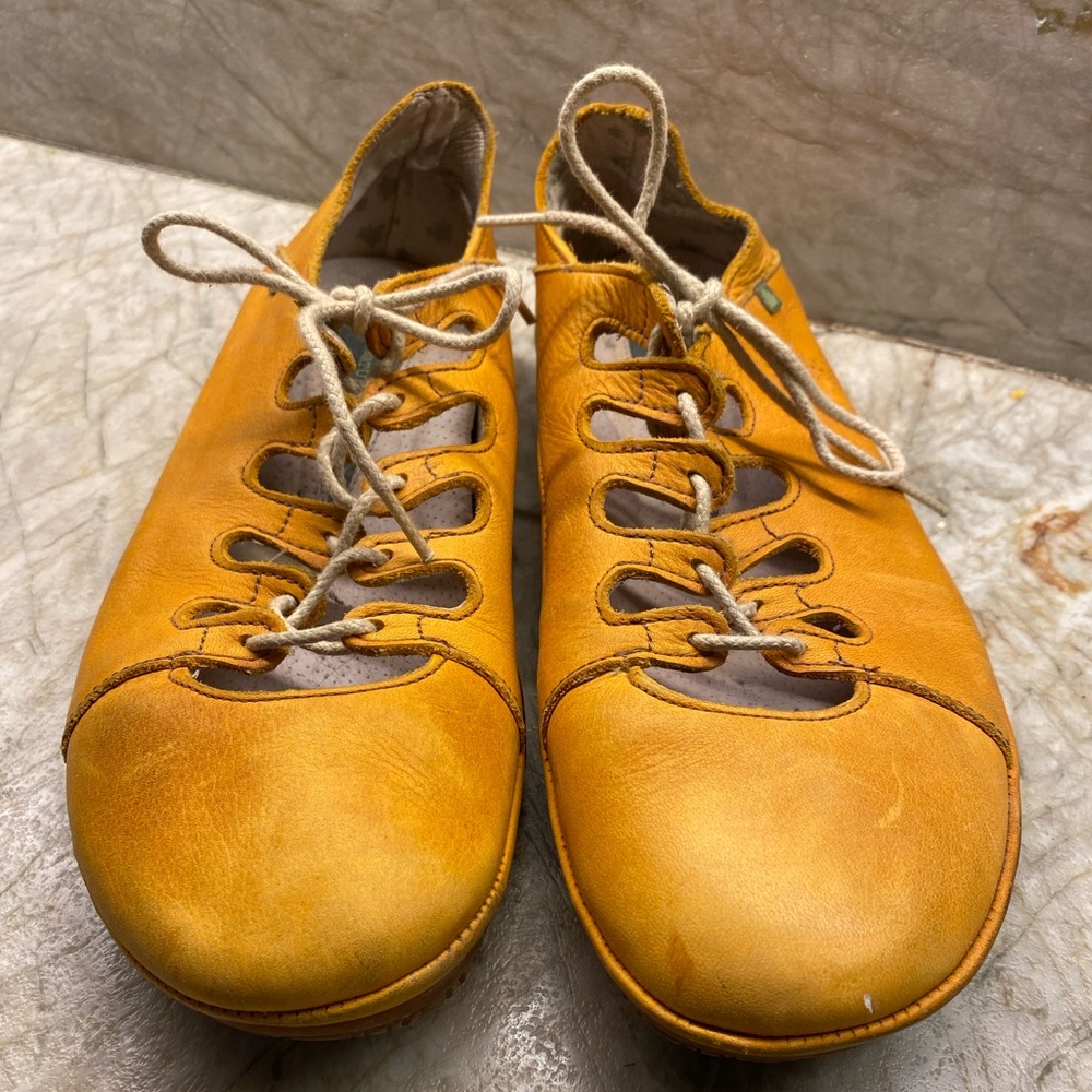 Burnt orange walking shoes by El Naturalista. Lace up rubber soled shoe.